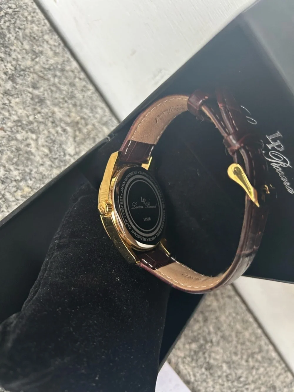 Lucien Piccard Gold Tone Case with Brown Strap and White Dial Accents
